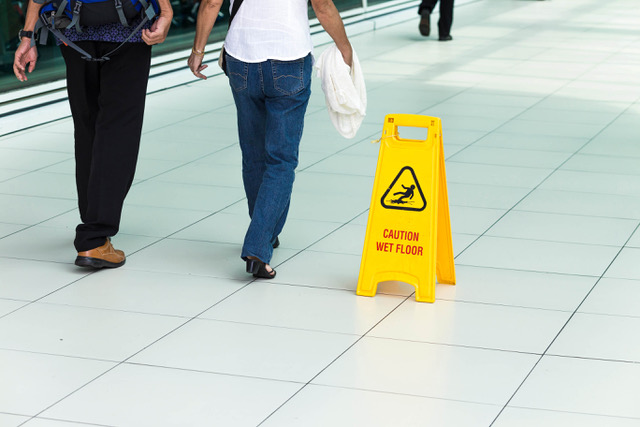 Water hazard sign warns against slip and fall injury in Florida.